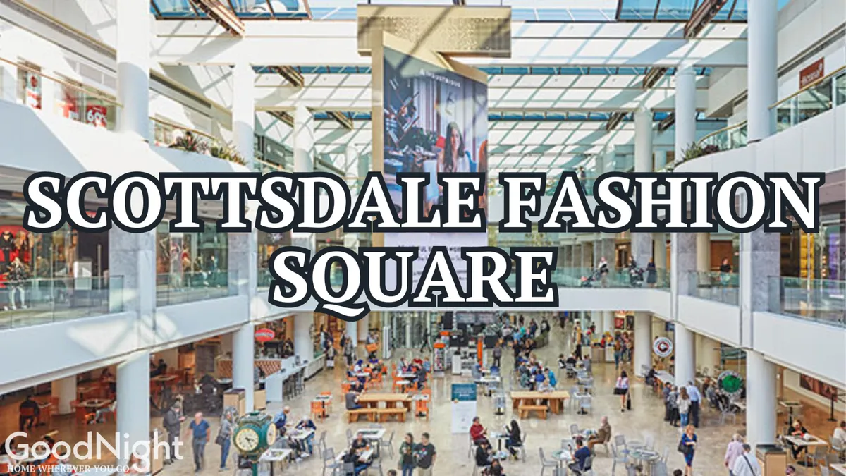 The bustling interior of Fashion Square, featuring a large central atrium with a digital display, comfortable seating areas, and shops lining the walls. The space is filled with energy and modern design, perfect for grabbing a coffee, people-watching, or enjoying a quick shopping break after work.